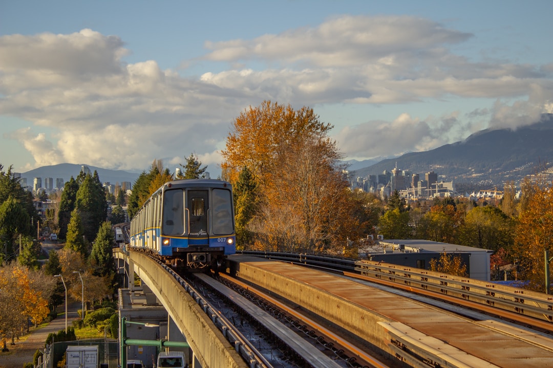 SkyTrain train traveling through lush forest in Metro Vancouver British Columbia