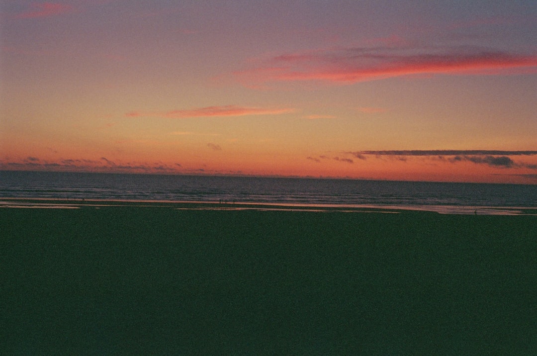 Warm ocean sunset over calm water near the BC coast