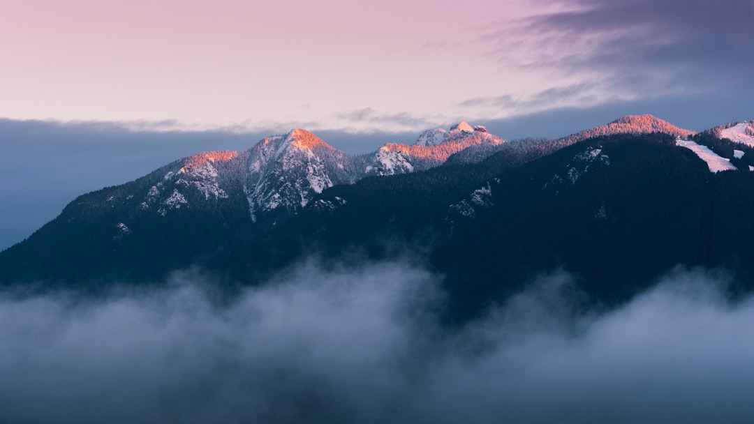 View of BC mountains bathed in golden sunset light representing craft cannabis culture